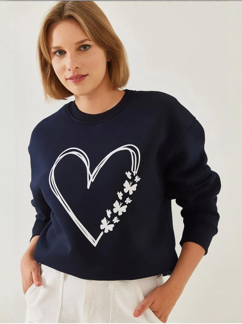 Sweat-shirt ras du cou en fil brossé imprimé cœur lucci - Kiabi Sweat-shirt ras du cou en fil brossé imprimé cœur lucci - Kiabi