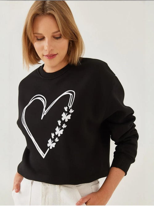 Sweat-shirt ras du cou en fil brossé imprimé cœur lucci - Kiabi Sweat-shirt ras du cou en fil brossé imprimé cœur lucci - Kiabi