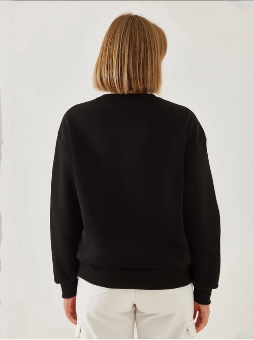 Sweat-shirt ras du cou en fil brossé imprimé cœur lucci - Kiabi Sweat-shirt ras du cou en fil brossé imprimé cœur lucci - Kiabi
