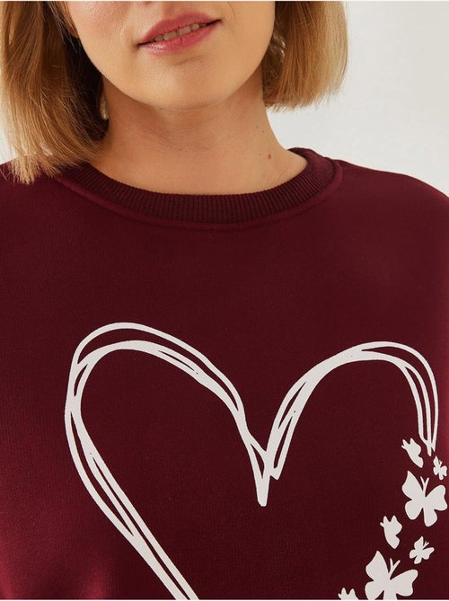 Sweat-shirt ras du cou en fil brossé imprimé cœur lucci - Kiabi Sweat-shirt ras du cou en fil brossé imprimé cœur lucci - Kiabi