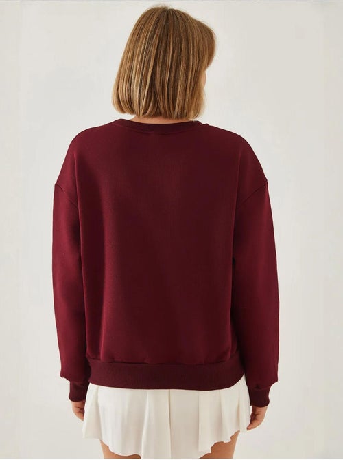Sweat-shirt ras du cou en fil brossé imprimé cœur lucci - Kiabi Sweat-shirt ras du cou en fil brossé imprimé cœur lucci - Kiabi