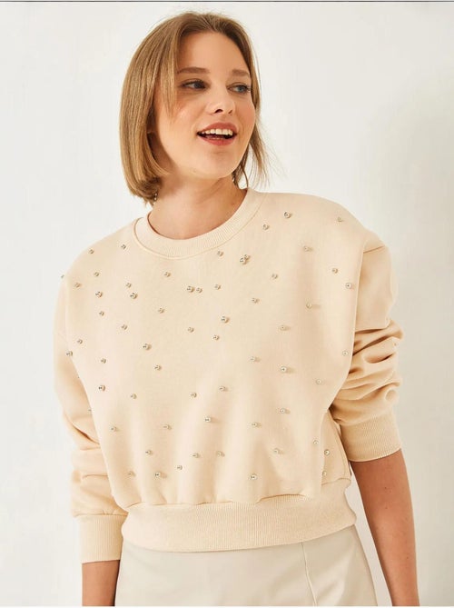 Sweat-shirt ras du cou lucci en tissu brossé triple fil orné de perles - Kiabi Sweat-shirt ras du cou lucci en tissu brossé triple fil orné de perles - Kiabi