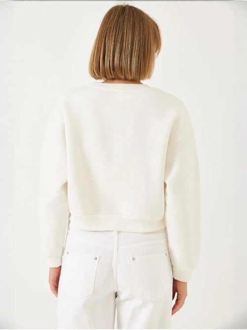 Sweat-shirt ras du cou lucci en tissu brossé triple fil orné de perles - Kiabi Sweat-shirt ras du cou lucci en tissu brossé triple fil orné de perles - Kiabi