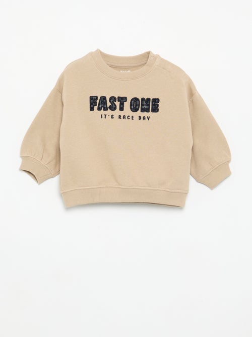 Sweat uni avec imprimé poitrine - Kiabi