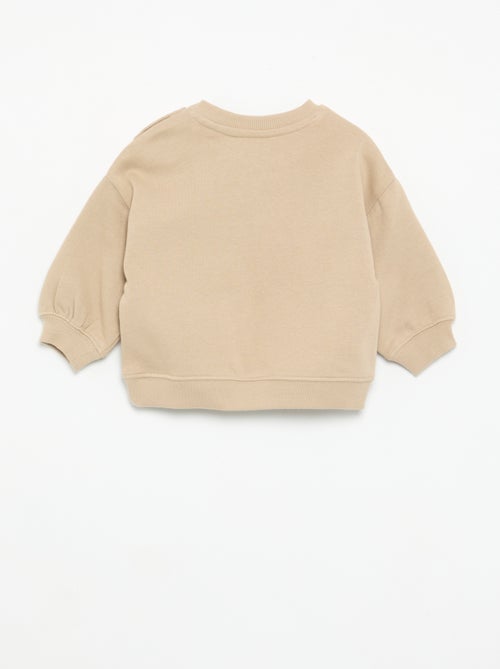 Sweat uni avec imprimé poitrine - Kiabi