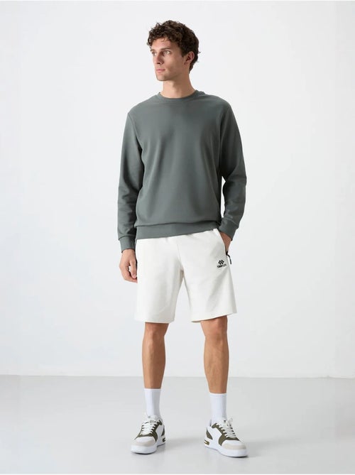 Sweatshirt homme uni à col rond tommy - Kiabi Sweatshirt homme uni à col rond tommy - Kiabi