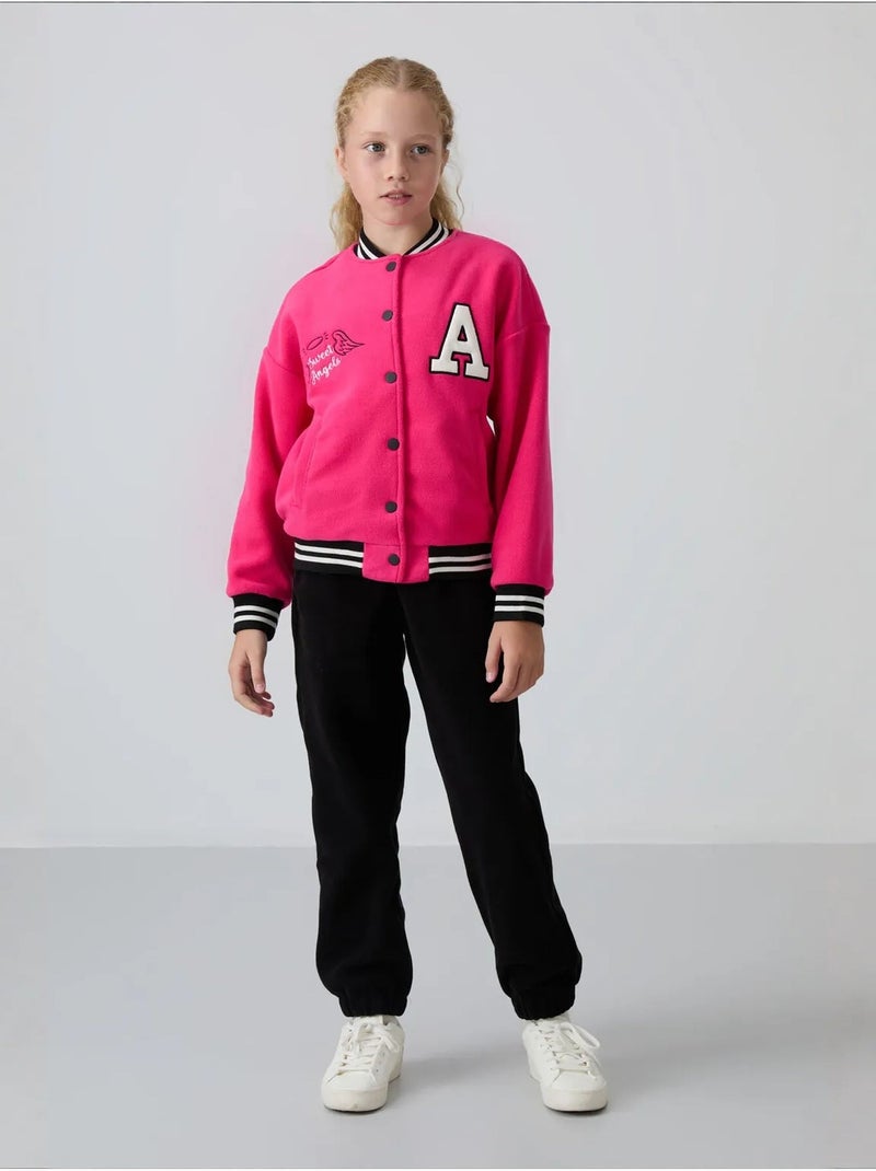 Sweatshirt jeunesse à pressions tommy Rose fluo/Solinotes - Kiabi