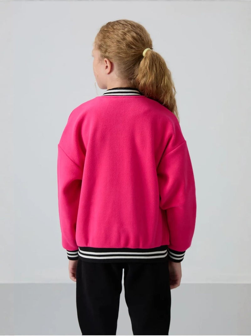 Sweatshirt jeunesse à pressions tommy Rose fluo/Solinotes - Kiabi