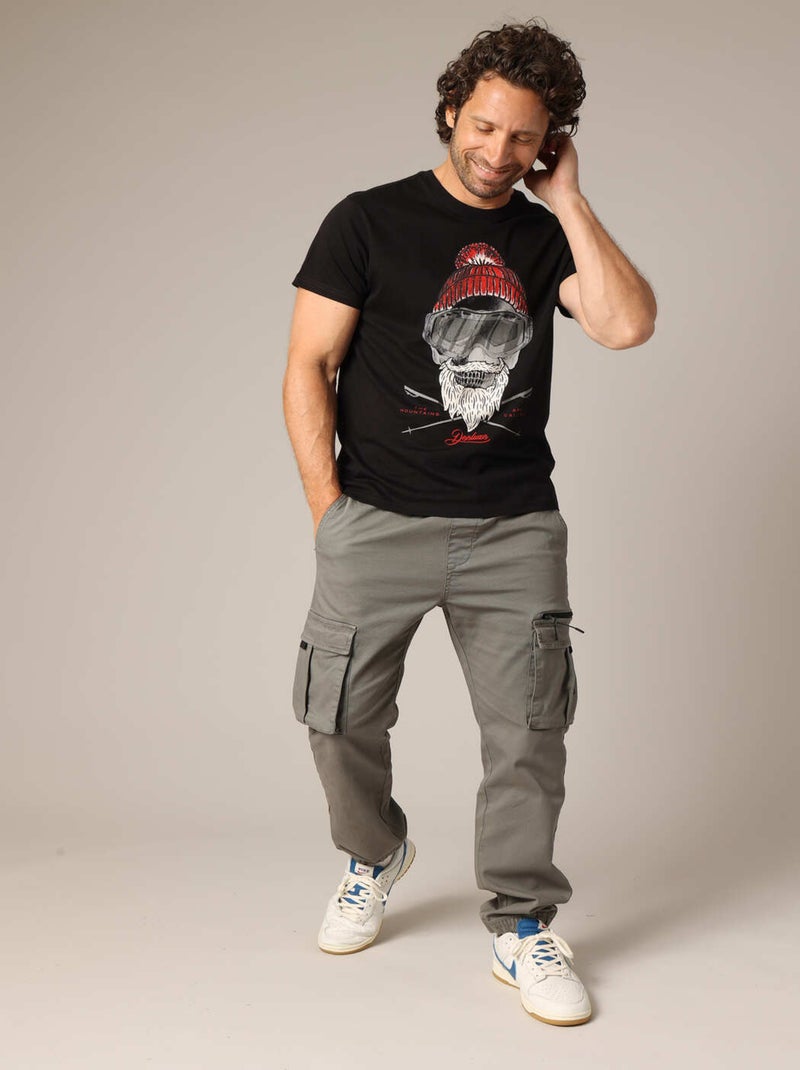 T-shirt 100% coton avec illustration originale d'un skieur barbu au style vintage. 'Deeluxe' Noir - Kiabi