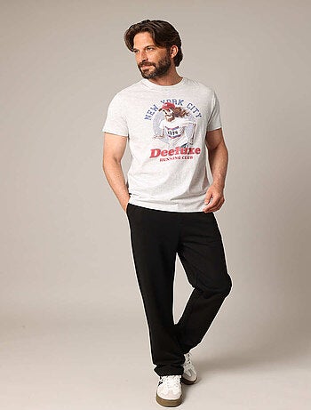 T-shirt 100% coton avec imprimé squelette coureur, col rond et coupe droite. 'deeluxe'