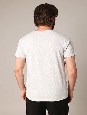 T-shirt 100% coton avec imprimé squelette coureur, col rond et coupe droite. 'deeluxe'