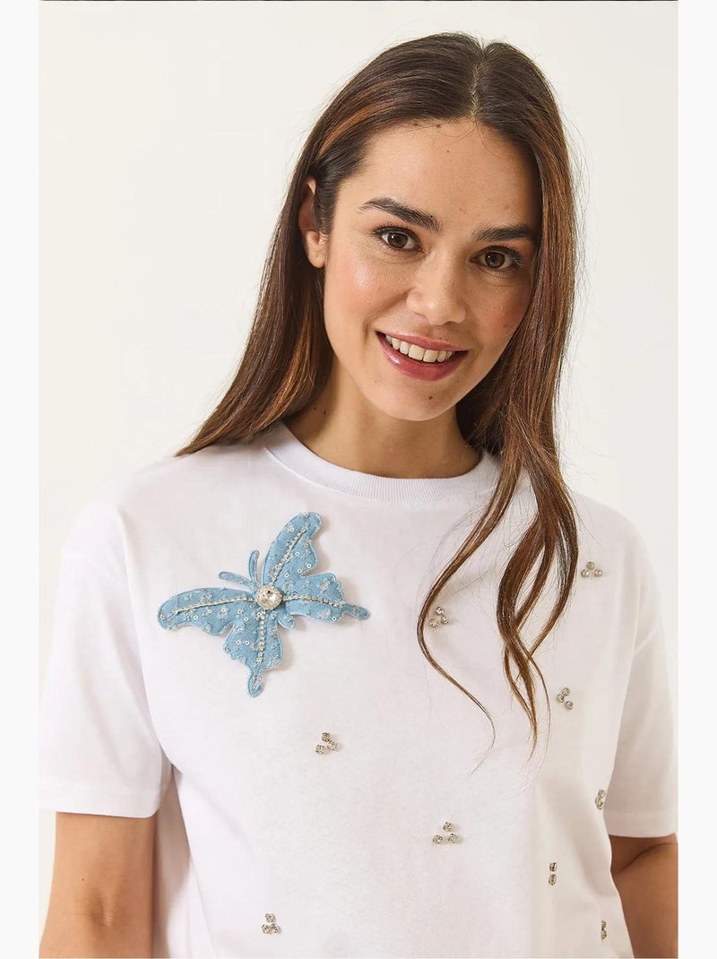 T-shirt à manches courtes avec accessoires papillon et ornements en pierre lucci Blanc - Kiabi