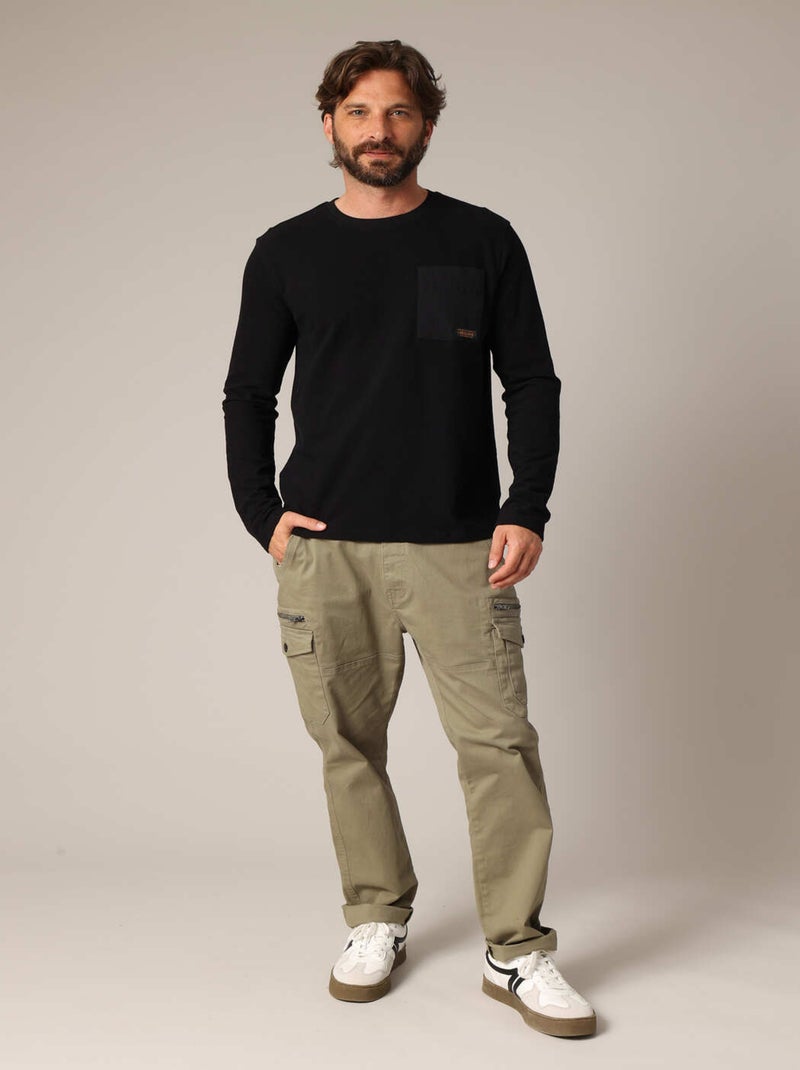 T-shirt à manches longues 100% coton avec poche poitrine contrastée.
 'Deeluxe' Noir - Kiabi