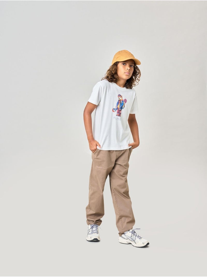 T-shirt confort garçon en 100% coton imprimé ourson snowboard 'deeluxe' Beige sable - Kiabi