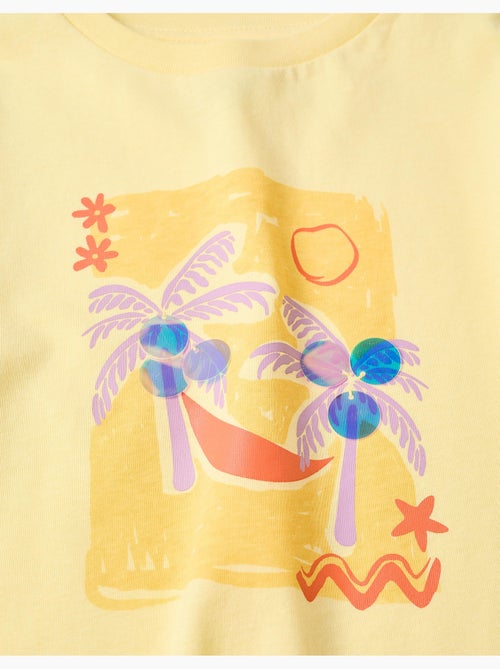 T-shirt en coton avec imprimé palmiers et paillettes - Kiabi T-shirt en coton avec imprimé palmiers et paillettes - Kiabi