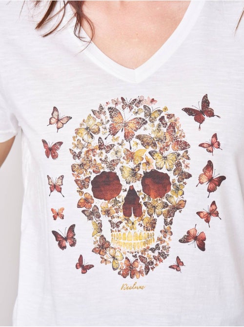T-shirt femme en 100% coton avec imprimé tête de mort florale 'deeluxe' - Kiabi T-shirt femme en 100% coton avec imprimé tête de mort florale 'deeluxe' - Kiabi