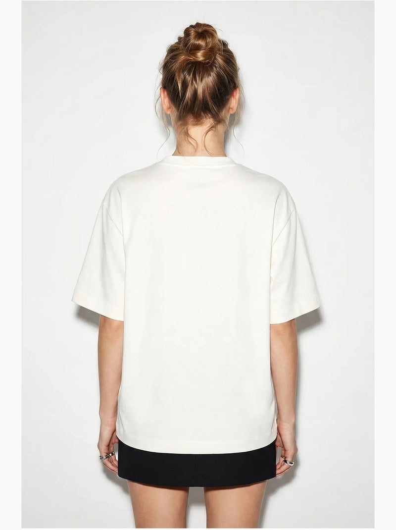 T-shirt femme en coton à col bateau et imprimé lucci Blanc cassé - Kiabi
