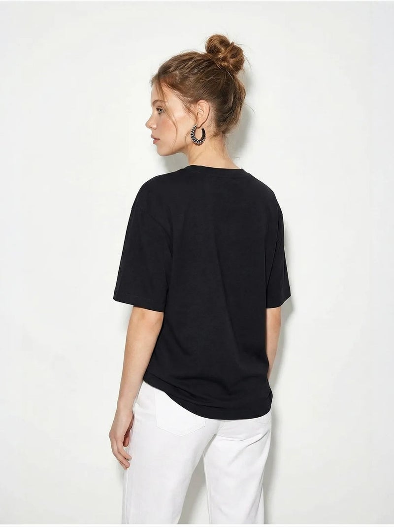 T-shirt femme en coton à col bateau et imprimé lucci Noir - Kiabi