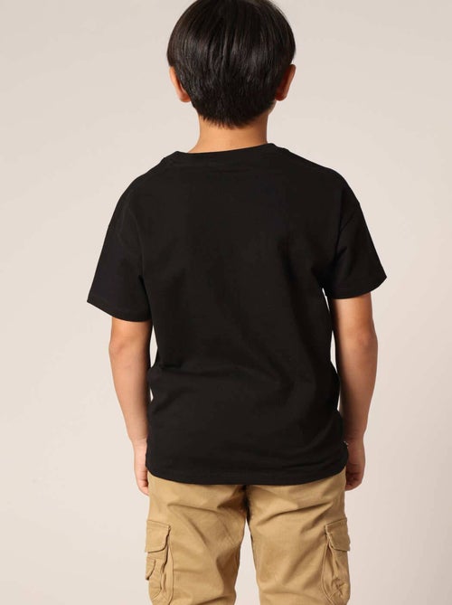 T-shirt fille avec imprimé pailleté et badge au dos 'Deeluxe' - Kiabi