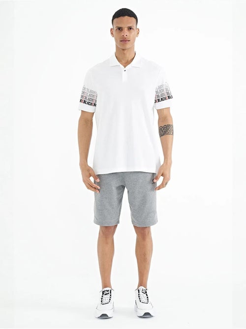 T-shirt imprimé à col polo tommy - Kiabi T-shirt imprimé à col polo tommy - Kiabi