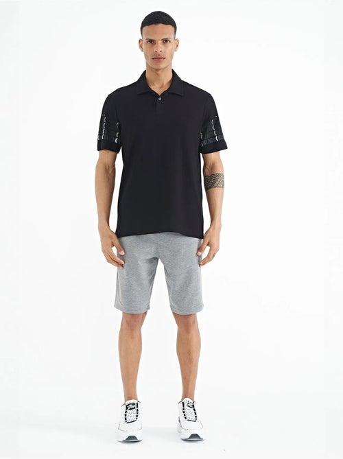 T-shirt imprimé à col polo tommy - Kiabi T-shirt imprimé à col polo tommy - Kiabi