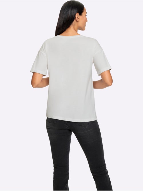 T shirt imprimé lettrage fantaisie encolure ronde et manches courtes - Taille standard - Helline - Kiabi T shirt imprimé lettrage fantaisie encolure ronde et manches courtes - Taille standard - Helline - Kiabi
