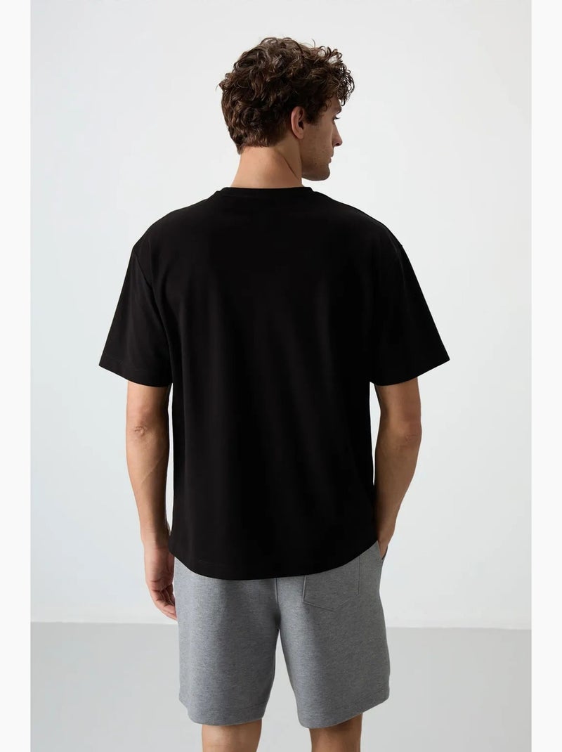 T-shirt oversize à col rond imprimé tommy Noir - Kiabi