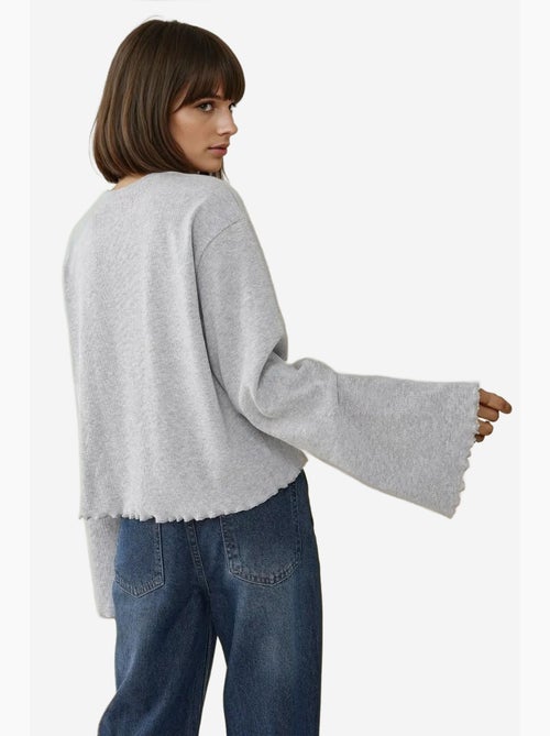 T-shirt oversize à manches longues et ourlet ondulé hiccup - Kiabi T-shirt oversize à manches longues et ourlet ondulé hiccup - Kiabi