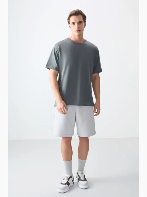 T-shirt oversize en coton à col rond tommy - Kiabi T-shirt oversize en coton à col rond tommy - Kiabi