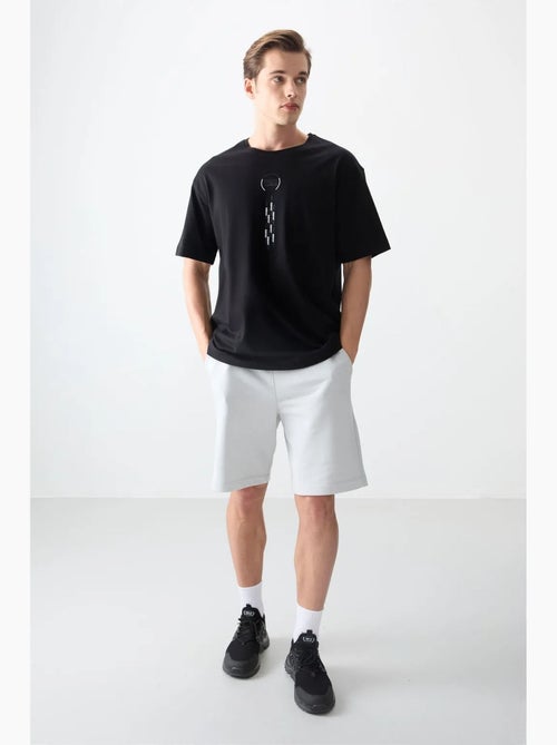 T-shirt oversize en coton avec imprimé texte et col rond tommy - Kiabi T-shirt oversize en coton avec imprimé texte et col rond tommy - Kiabi