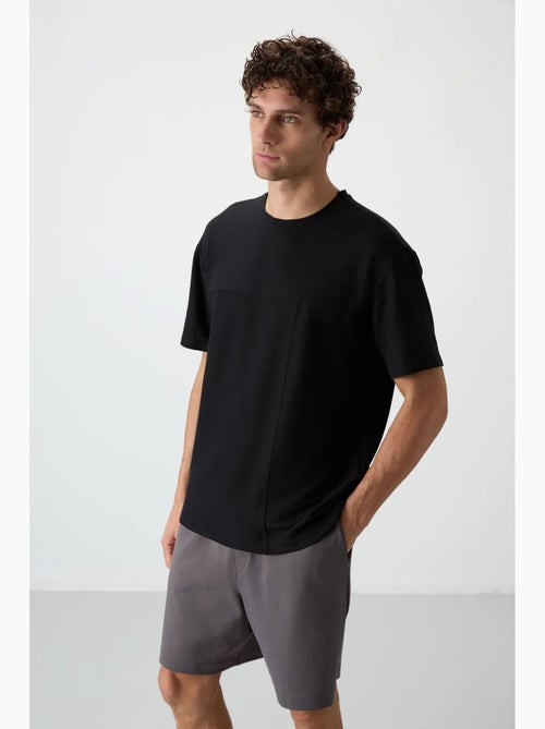 T-shirt oversize en jersey avec poche tommy - Kiabi T-shirt oversize en jersey avec poche tommy - Kiabi