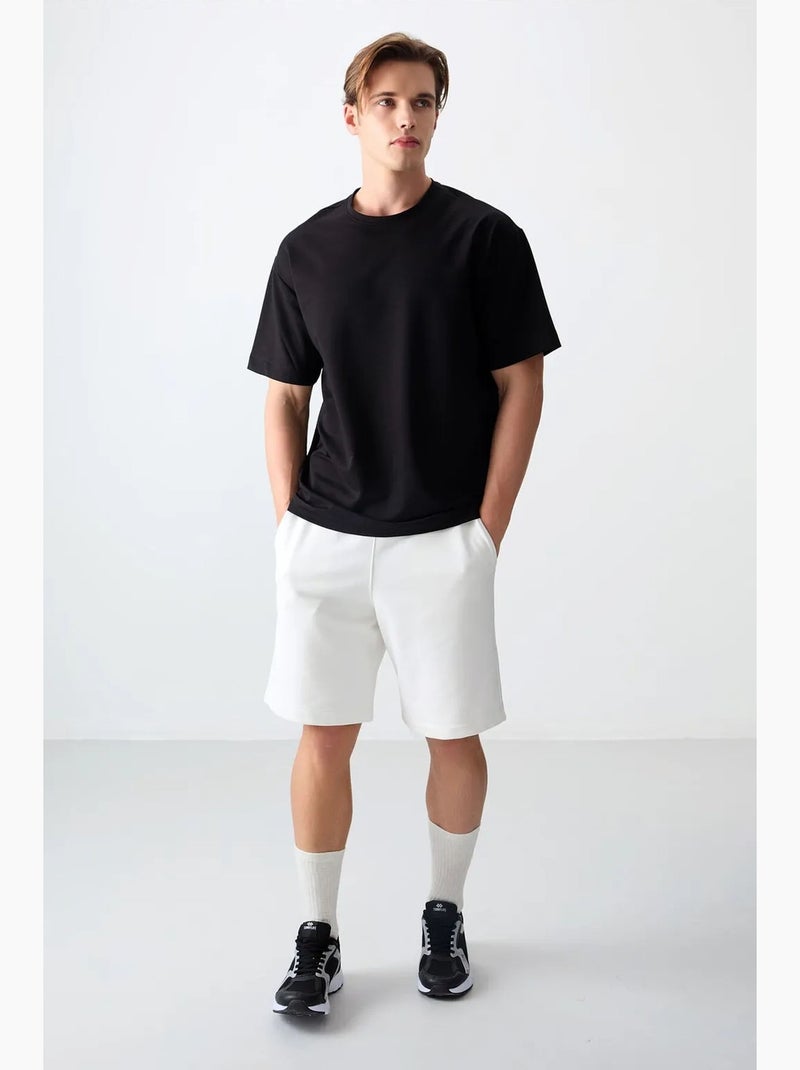 T-shirt oversize en mélange de coton à col rond tommy Noir - Kiabi
