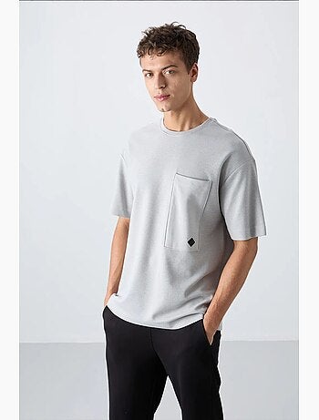 T-shirt oversize en mélange de coton avec poche et col rond tommy