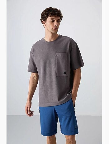 T-shirt oversize en mélange de coton avec poche et col rond tommy