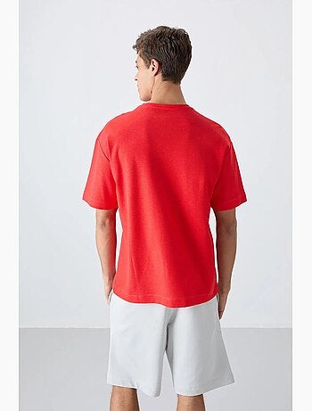 T-shirt oversize en mélange de coton avec poche et col rond tommy