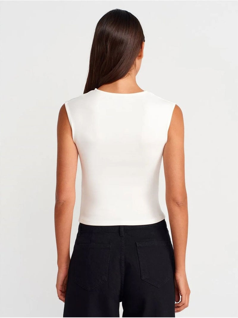 T-shirt sans manches côtelé à col rond et coupe ajustée dilvin Blanc cassé - Kiabi