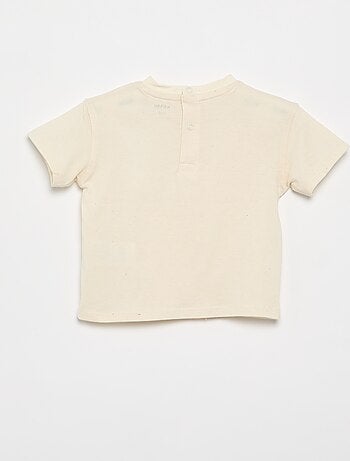 T-shirt uni avec fleurs fantaisies au col