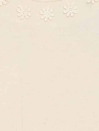 T-shirt uni avec fleurs fantaisies au col