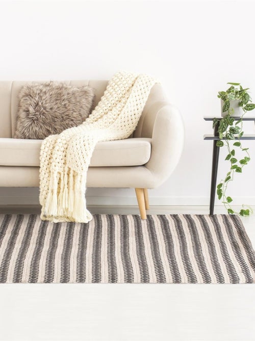 Tapis rectangle beige motifs noir 120x170 cm - Kiabi
