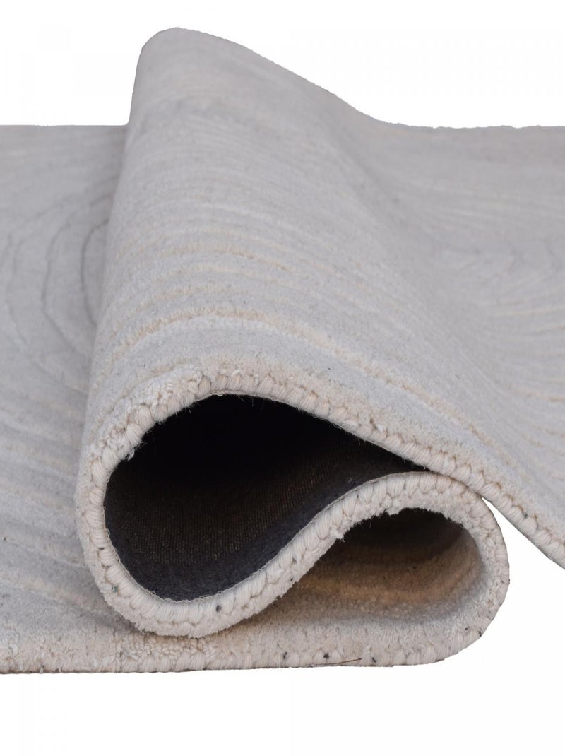 Tapis salon et chambre fait à la main en laine motif faux uni IZ Ecru - Kiabi