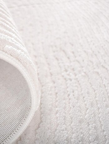 Tapis salon et chambre tissé motif faux uni DAMCIA