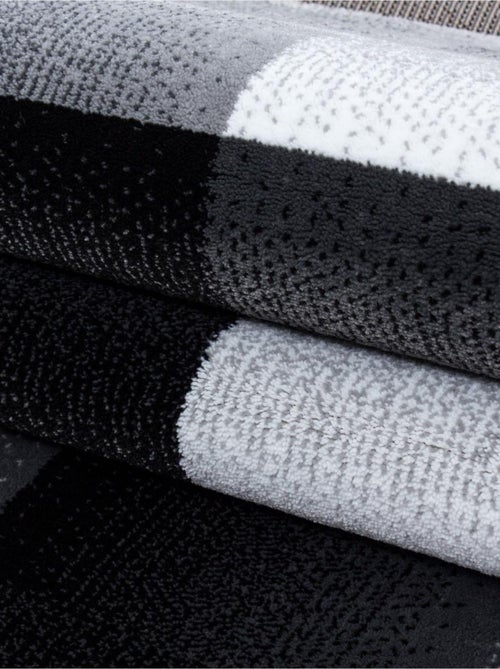 Tapis salon et chambre tissé motif géométrique FLORINA - Kiabi Tapis salon et chambre tissé motif géométrique FLORINA - Kiabi