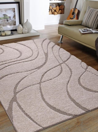 Tapis shaggy tissé motif géométrique POUDA