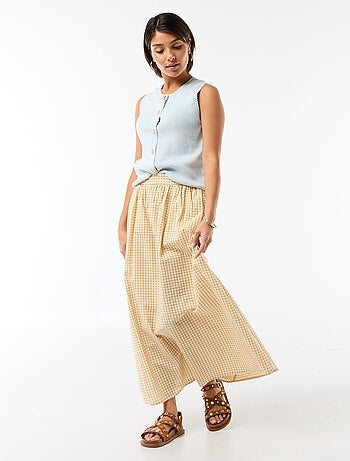 Top sans manches avec boutons dorés