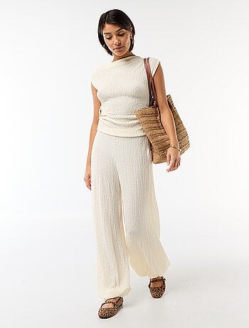 Top stretch uni asymétrique sans manches