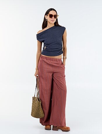 Top stretch uni asymétrique sans manches