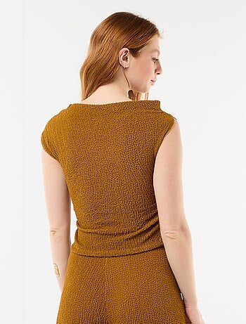 Top stretch uni asymétrique sans manches