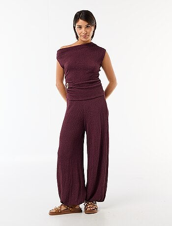 Top stretch uni asymétrique sans manches