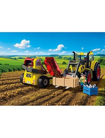 Tracteur avec récolteur de pommes de terre