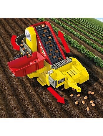 Tracteur avec récolteur de pommes de terre